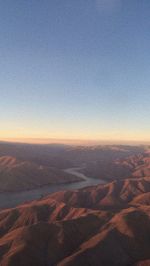 Aerial view of landscape against sky during sunset