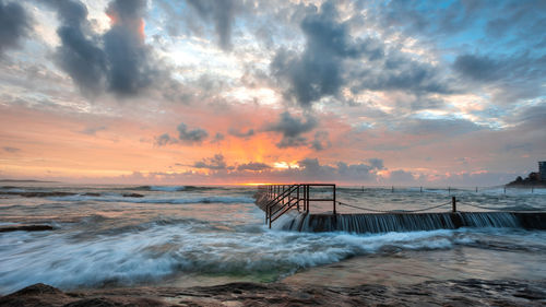 Scenic view of sea against sky during sunset