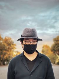 Portrait of man wearing hat against sky