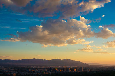 Townscape against sky during sunset