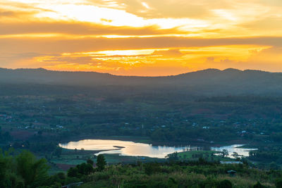 High angle view of townscape against orange sky