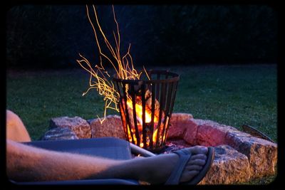 Person relaxing on grassy field