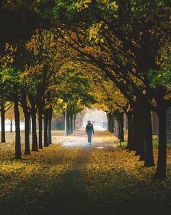 Woman walking in park during autumn