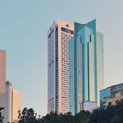 Low angle view of modern buildings against clear sky