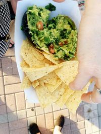 High angle view of hand holding food