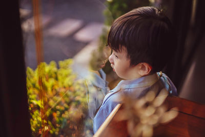 Close-up of young woman looking away