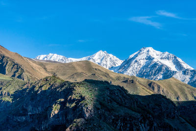 Snow-capped mountains in stepantsminda, aka kazbegi, georgia.