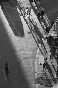 High angle view of people walking on road