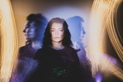 Multiple exposure of woman by firework display