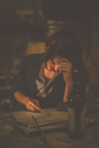 Portrait of young man sitting at table