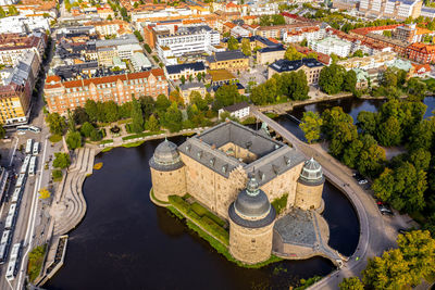 High angle view of river amidst buildings in city