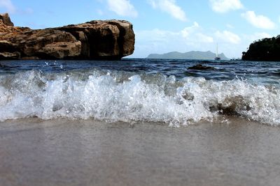 Waves rushing towards beach