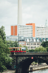 View of bridge in city against sky