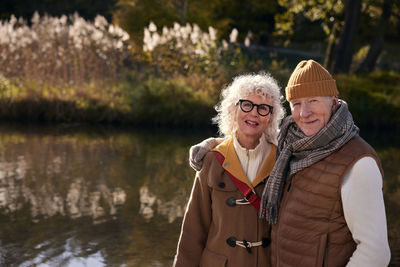 Senior couple next to lake in park