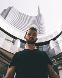 Low angle view of young man looking away