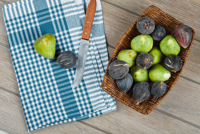 High angle view of fruits in basket on table