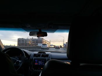 Close-up of hand on car windshield