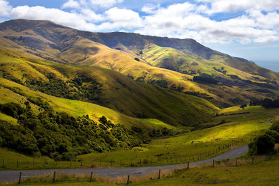 Scenic view of mountains against cloudy sky