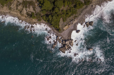 High angle view of river flowing through rocks