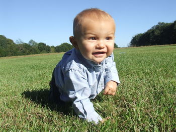 Portrait of smiling boy on field