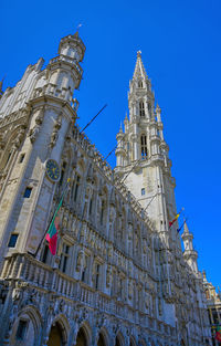 Low angle view of building against blue sky