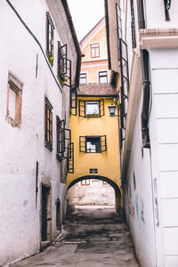 Narrow alley amidst buildings in city