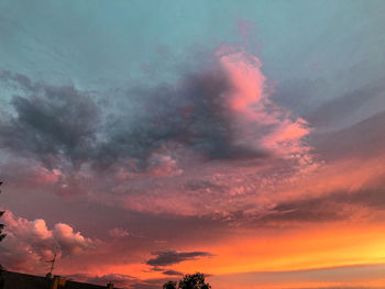 Low angle view of dramatic sky during sunset