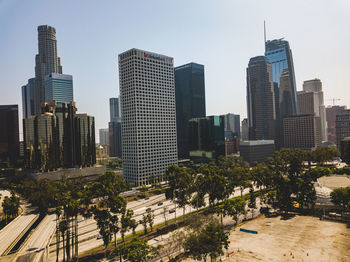 Modern buildings in city against sky