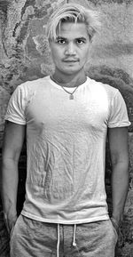 Portrait of man standing on field