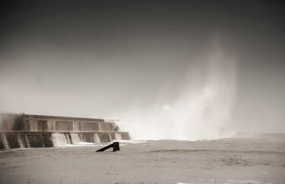 Person in sea against sky