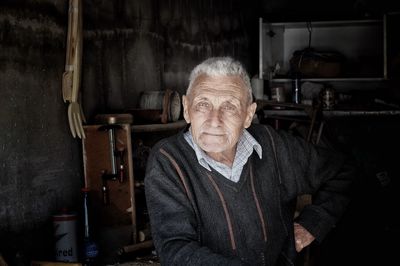 Portrait of senior man in workshop