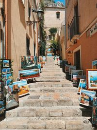 Picture frames on staircase by buildings