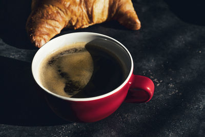 High angle view of coffee cup on table