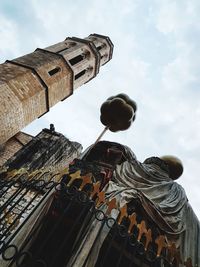 Low angle view of statue against building