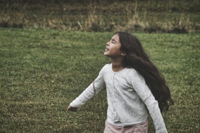 Girl playing in field