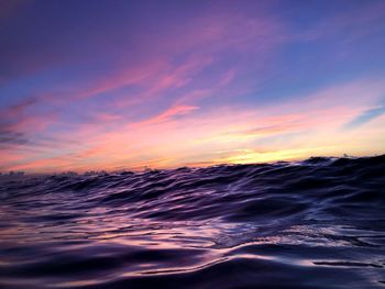 Scenic view of sea against romantic sky at sunset