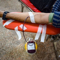 Blood donor at blood donation camp held with a bouncy ball holding in hand at balaji temple