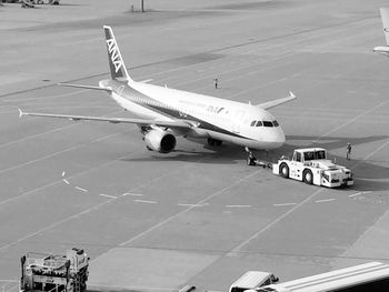 High angle view of airplane at airport runway