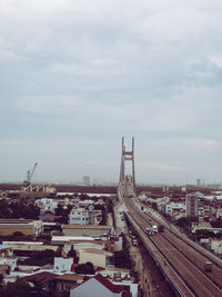 High angle view of city street and buildings against sky