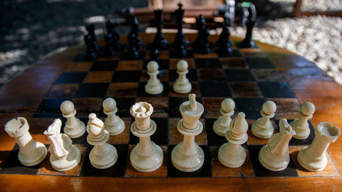 Close-up of chess pieces on table