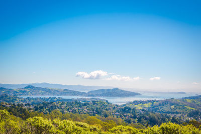 Scenic view of landscape against blue sky