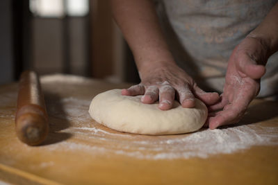 Midsection of person preparing food