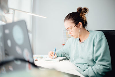 Businesswoman working at table