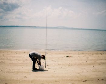 Dog standing on beach