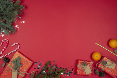 Low angle view of christmas tree against wall