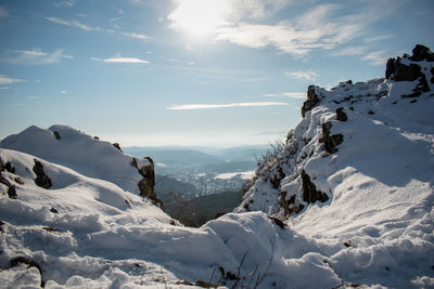 Scenic view of snow covered mountains against sky
