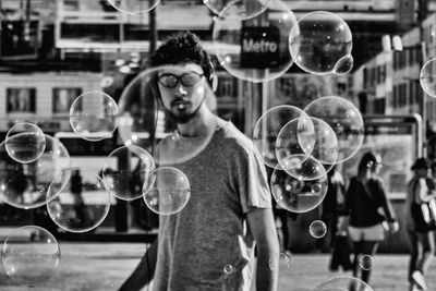 Young man in bubbles
