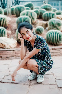 Portrait of smiling woman sitting outdoors