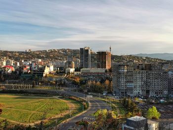 High angle view of buildings in city against sky