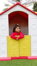 High angle view of girl playing with toy blocks